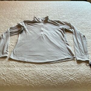 Pale gray Under Armour long sleeved work out top.